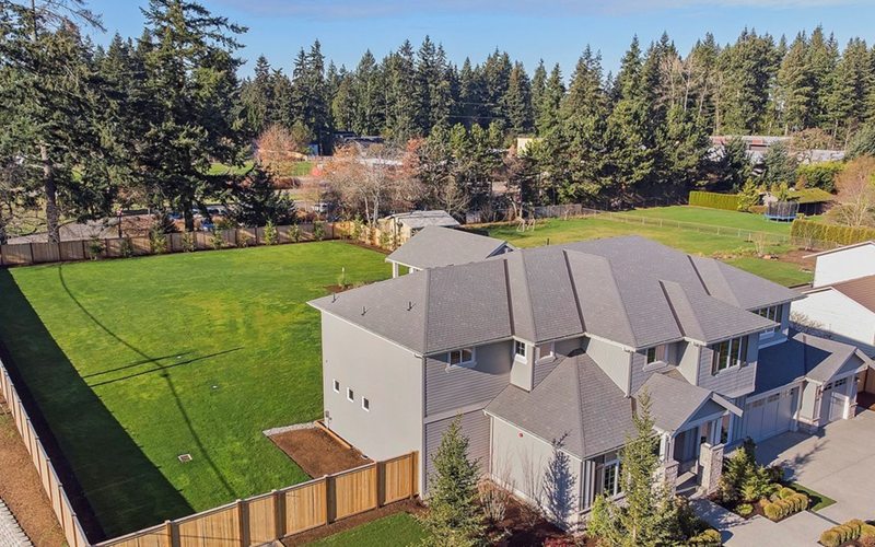 Aerial view of luxury home with expansive yard in Kirkland