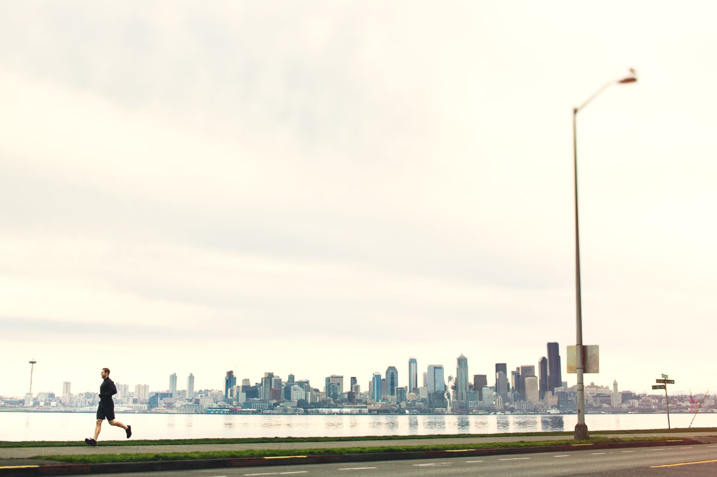 Man running at Alki Beach in Seattle