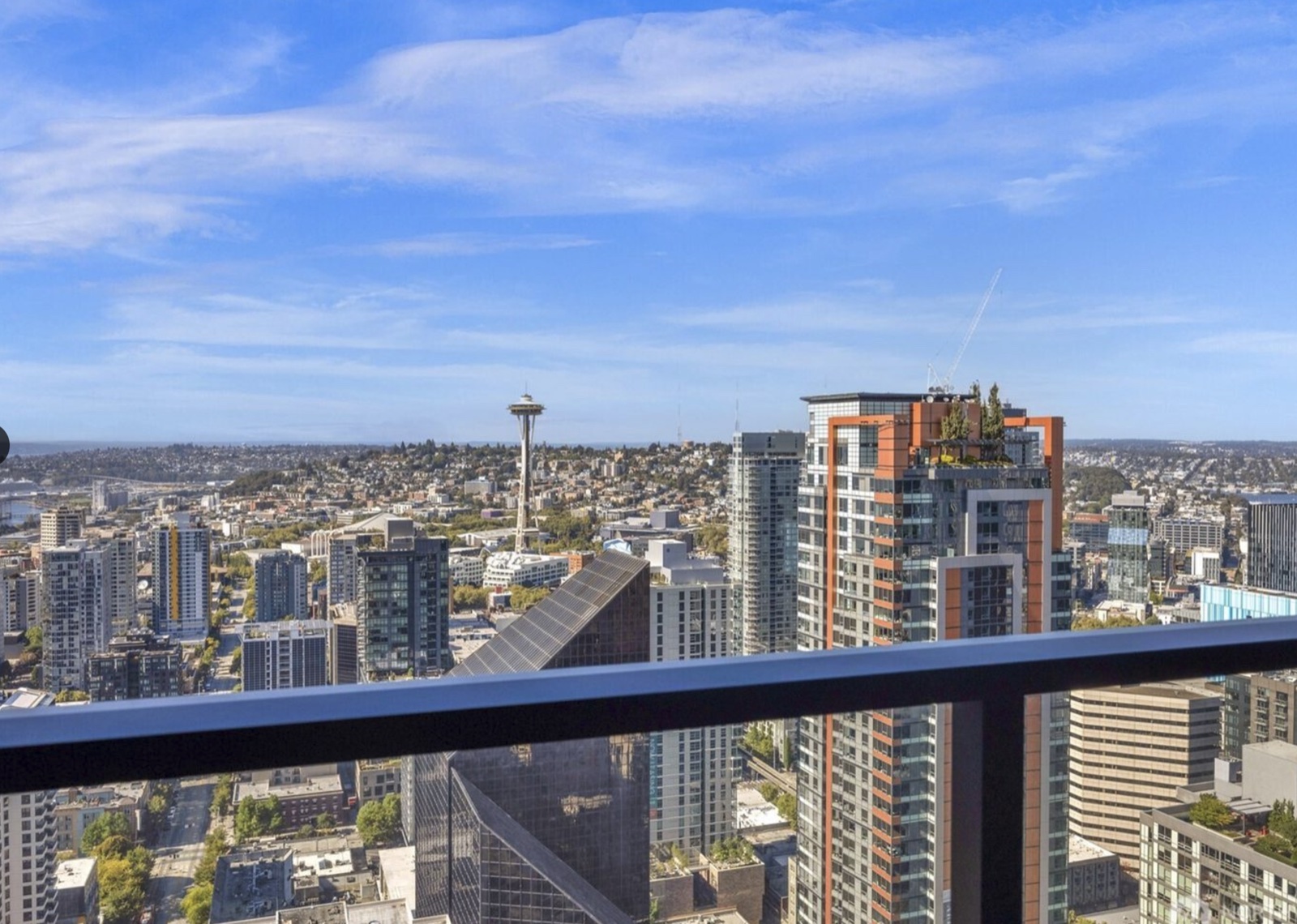 Living room at 300 Virginia #4111 with floor-to-ceiling views of Puget Sound