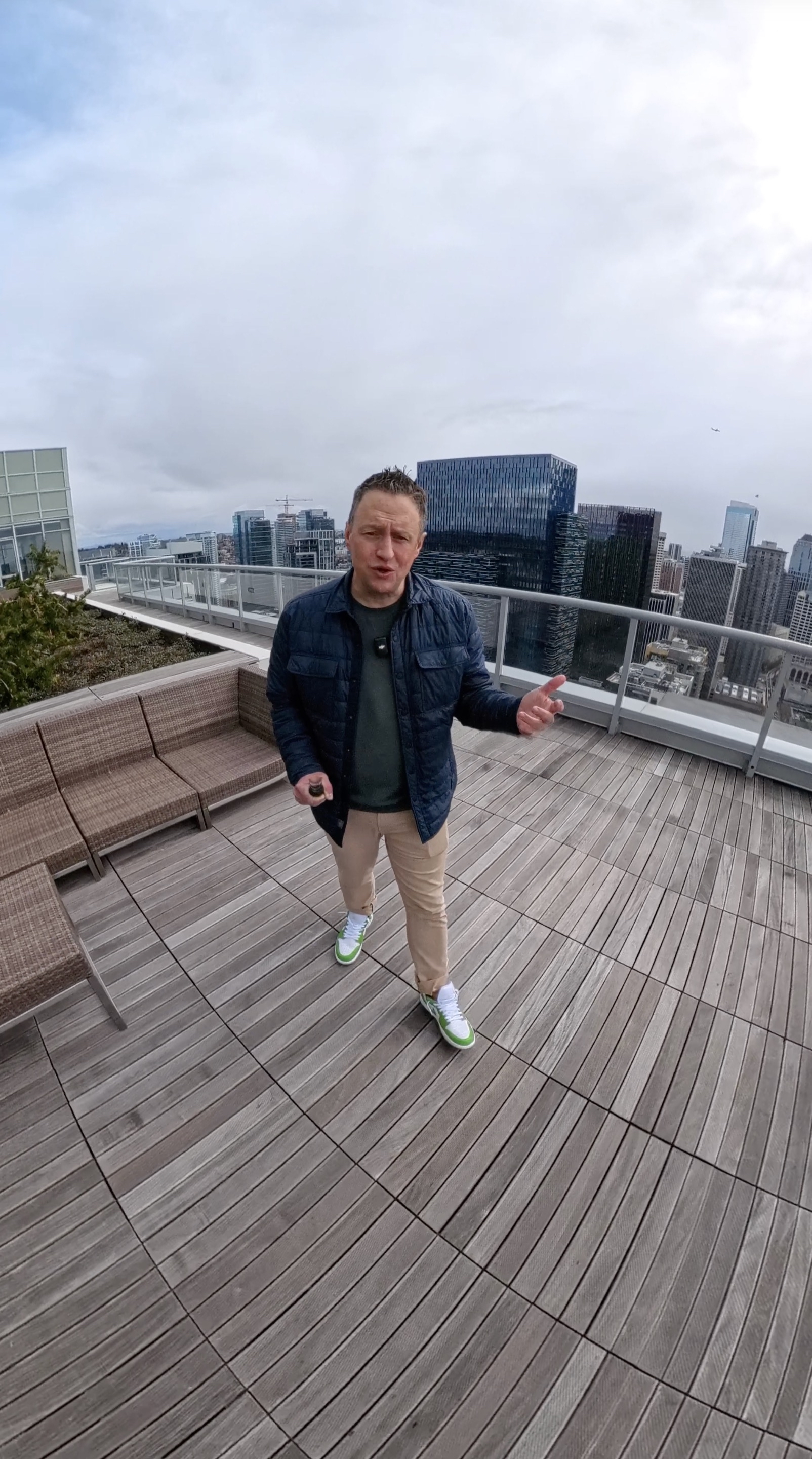 Jeff Reynolds — Seattle Condo Specialist, rooftop with Seattle downtown skyline